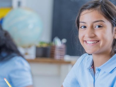 Smiling girl in classroom